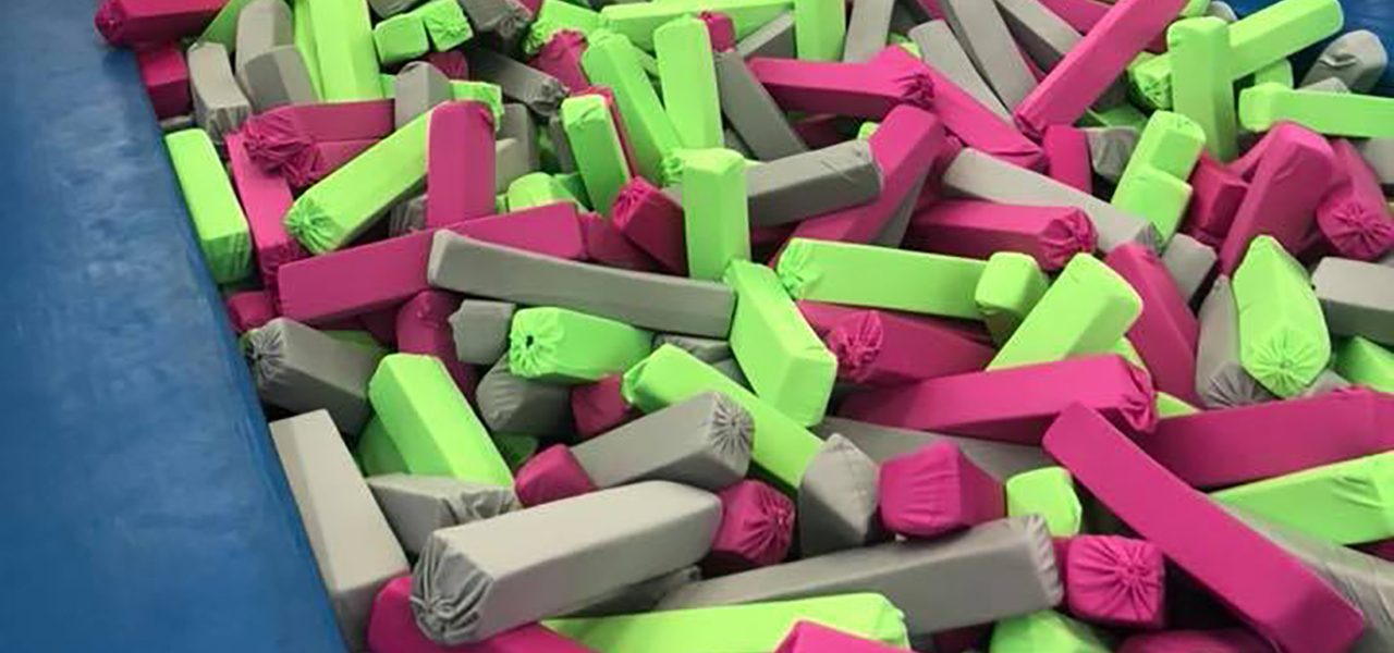 Pink and green covered foam pit blocks