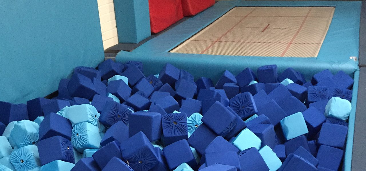 Blue foam cubes in a padded pit